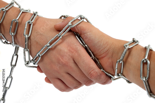 Hand shake in chains photo