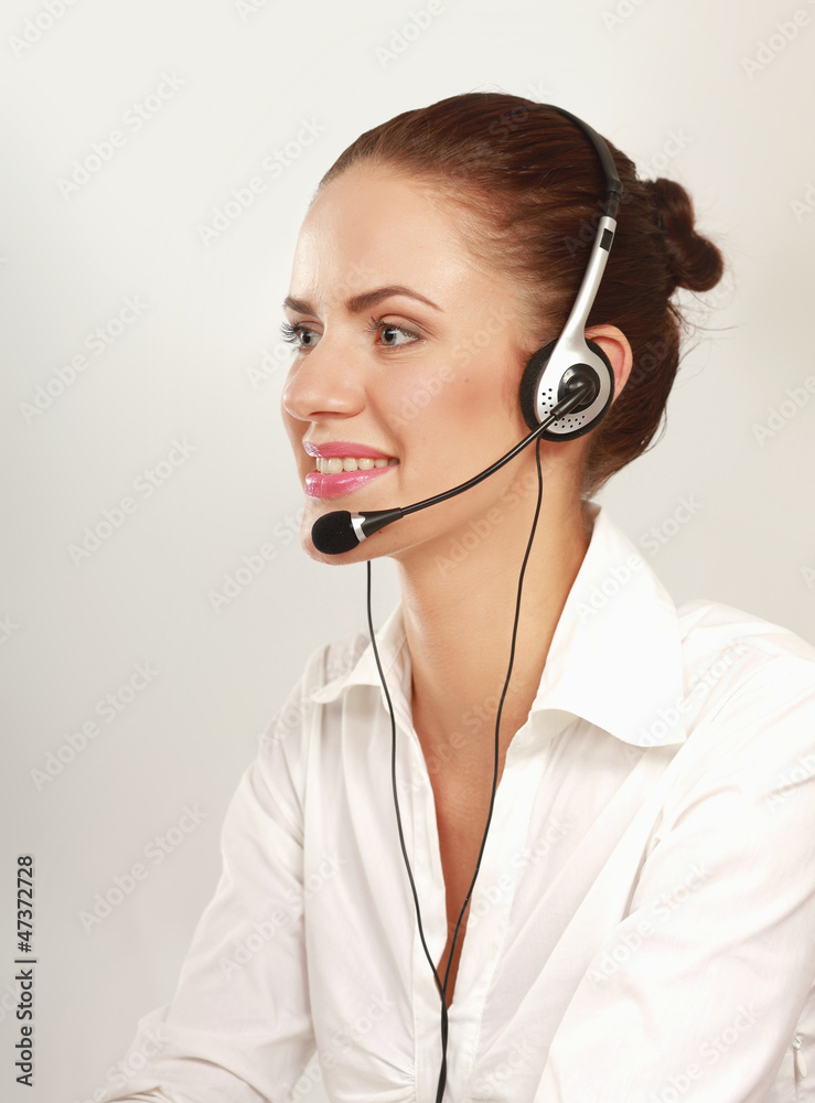 A smiling customer service girl isolated on white background A smiling customer service girl isolated on white background