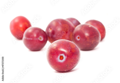 Ripe plums isolated on white background