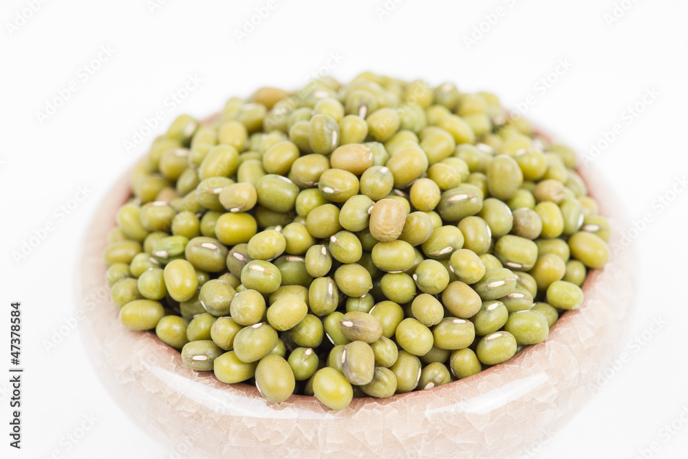 Green mung beans in bowl on white background Green mung beans in bowl on white background