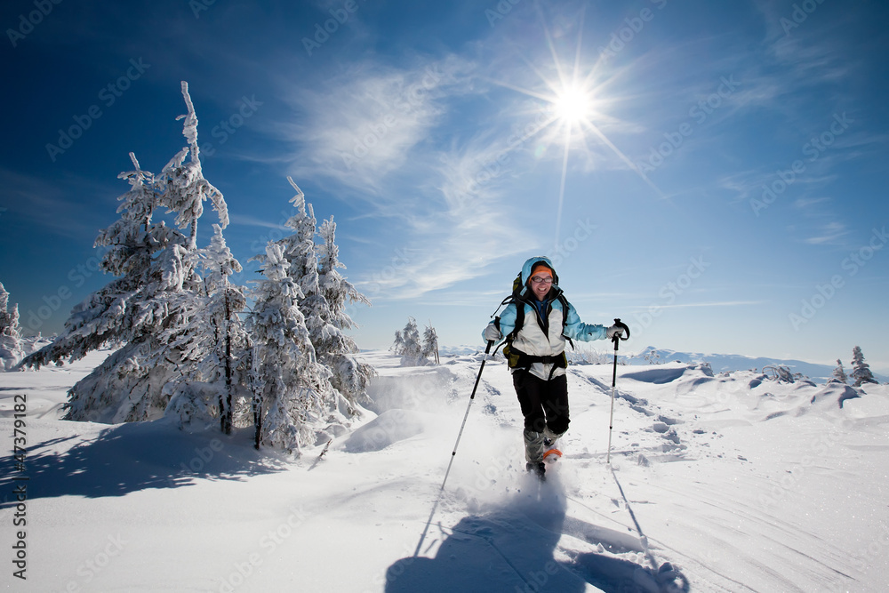 Hiker in winter mountains