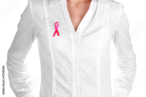 Woman with pink ribbon on white shirt isolated on white
