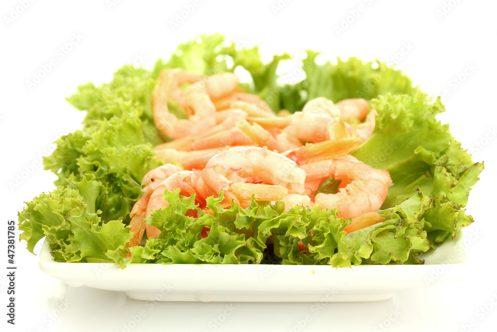 Boiled shrimps with lettuce leaves on plate, isolated on white Boiled shrimps with lettuce leaves on plate, isolated on white