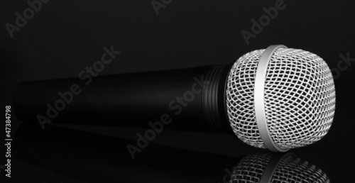 Black microphone isolated on black