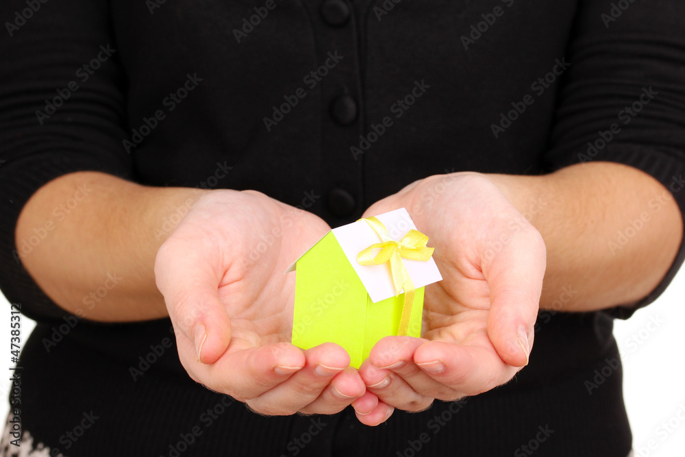 Small house in hands Small house in hands