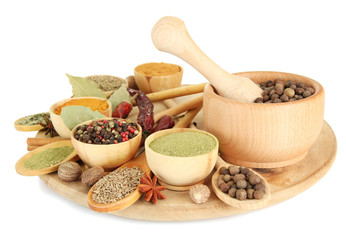 Fototapete Gewürze wooden mortar, bowls and spoons with spices isolated on white  © Africa Studio