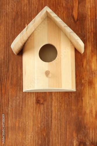 Nesting box on wooden background