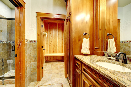 Luxury mountain home bathroom inetrior with stone and wood. photo