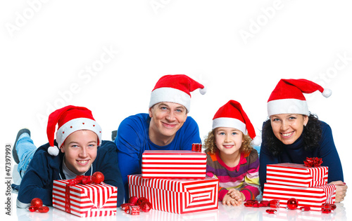 Family in Santa's hat with gift box