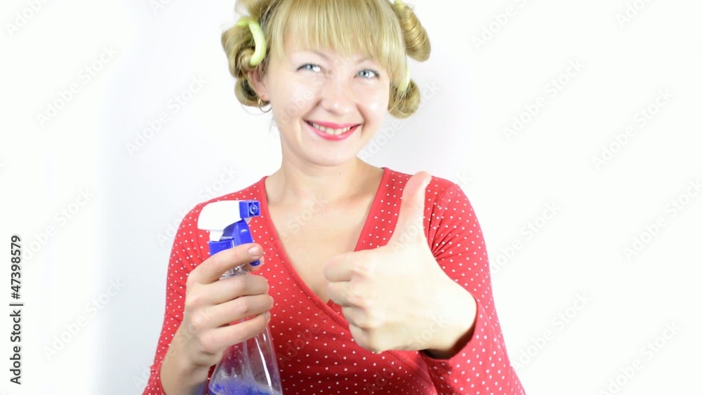 woman housewife in curlers with detergent woman housewife in curlers with detergent