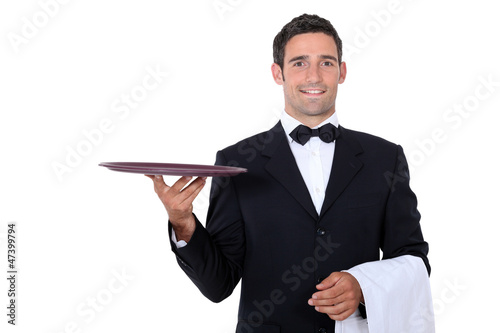 Waiter with tray smoking and balance
