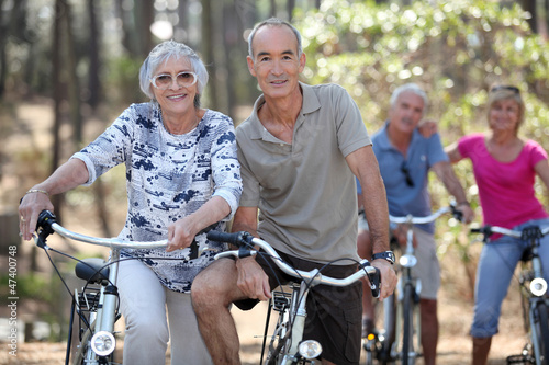 Mature couples on a double date biking. photo