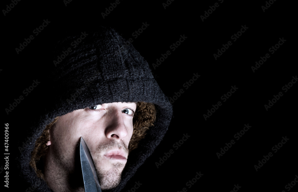 robber with a knife about to mug victim robber with a knife about to mug victim