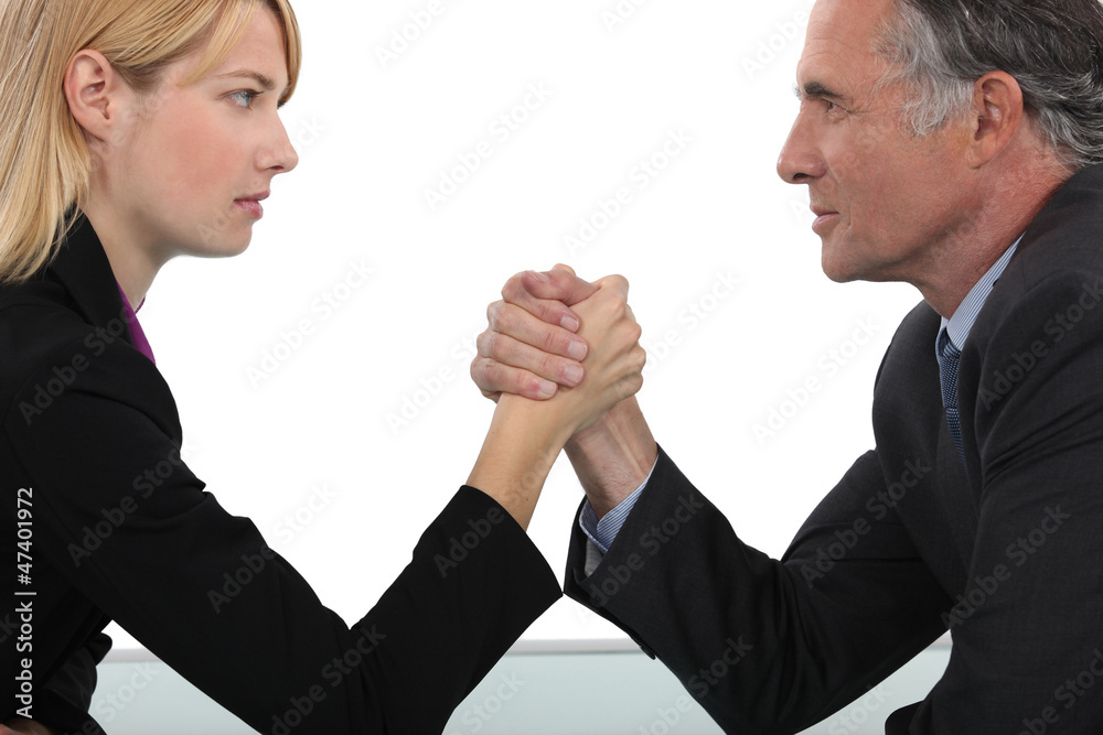 Boss and employee having an arm wrestle
