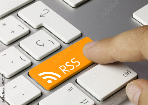 RSS keyboard key. Finger photo