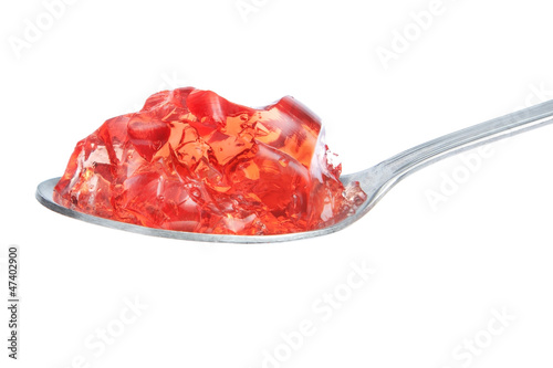 Εκτύπωση καμβά A spoon full of red gelatin. On a white background.