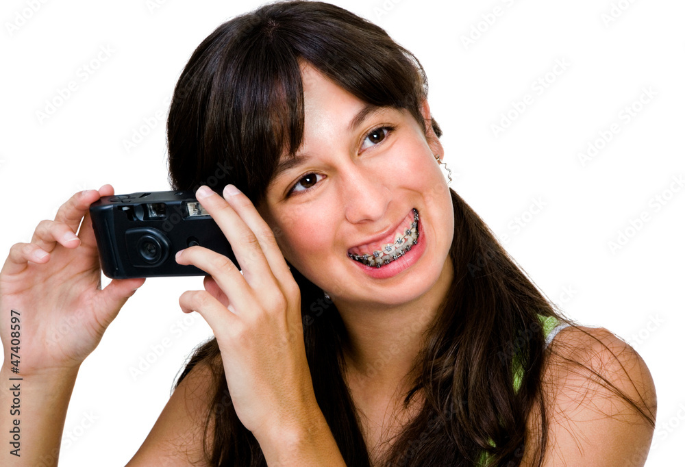 Smiling teenage girl photographing Smiling teenage girl photographing