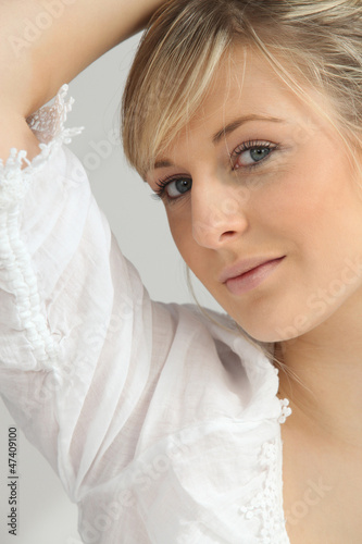 Pretty blonde in a white blouse