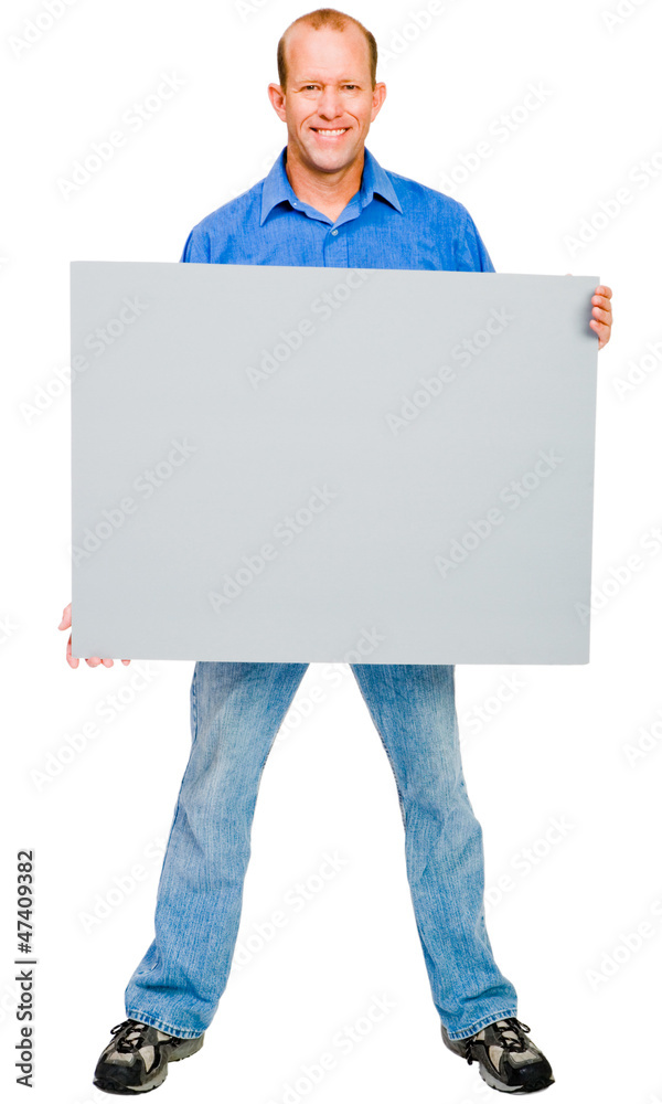 Smiling man showing placard Smiling man showing placard