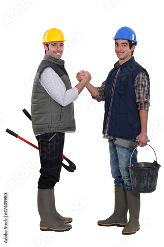 Construction workers greeting each other © auremar