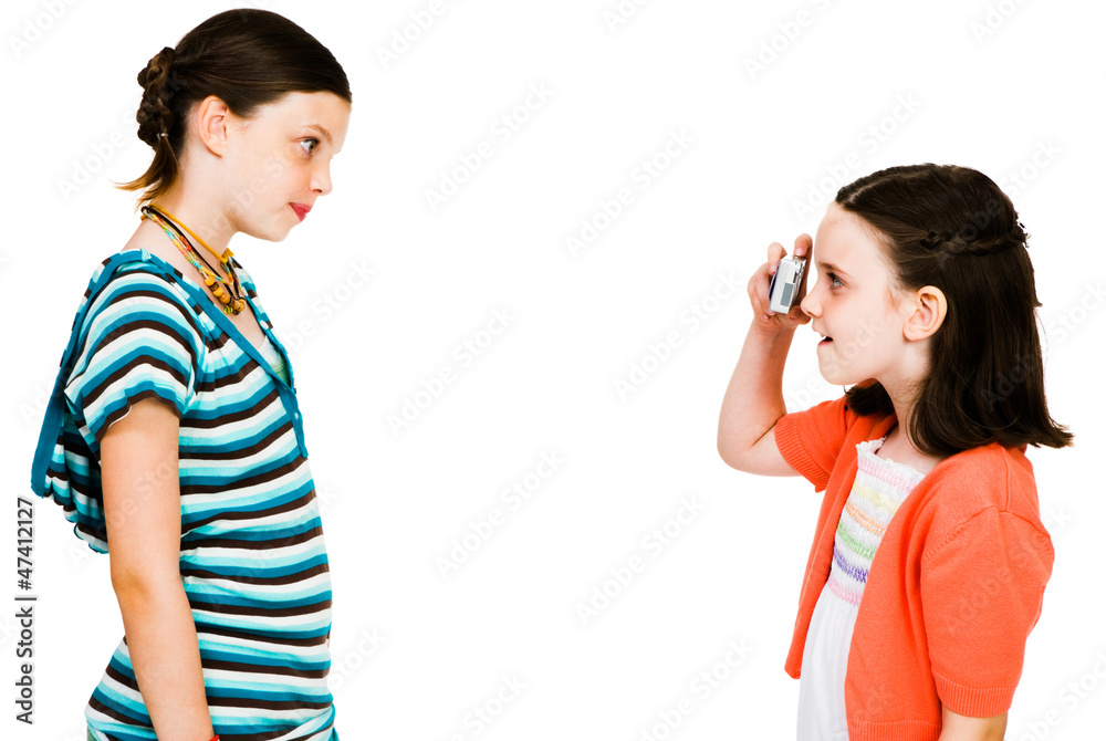 Cute girl taking picture of girl Cute girl taking picture of girl