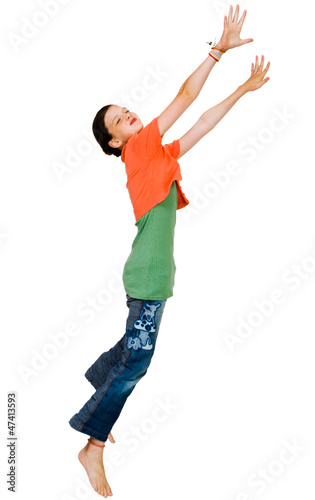Fototapeta Naklejka Na Ścianę i Meble -  Confident girl jumping