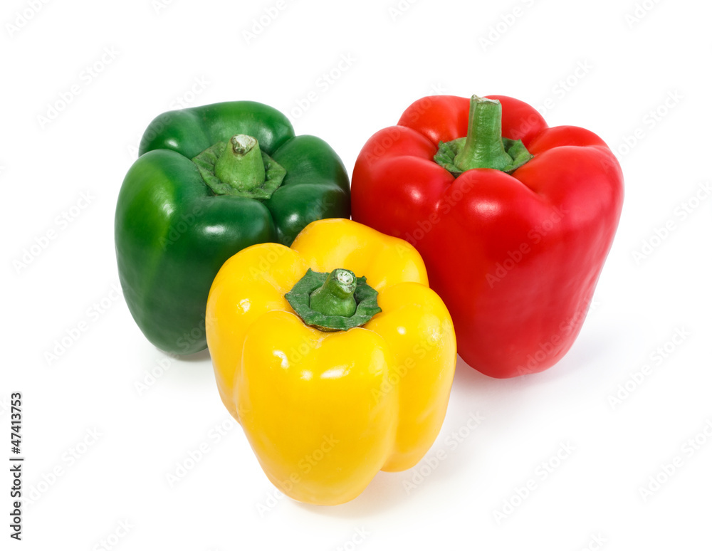 Three colored peppers vegetables isolated on white background. Three colored peppers vegetables isolated on white background.
