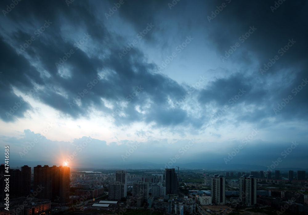 Dark clouds of night. The city