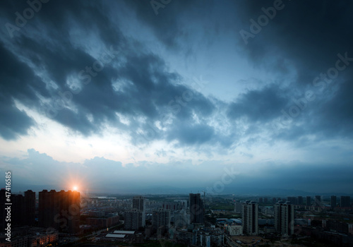 Dark clouds of night. The city
