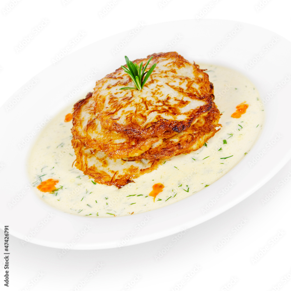 potato pancakes with white salmon and sour cream. isolated on wh