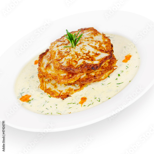 potato pancakes with white salmon and sour cream. isolated on wh