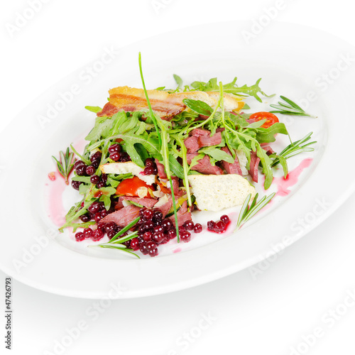 salad with cranberries and bacon. isolated on white background