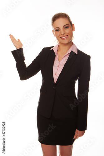 Smiling woman pointing with her hand