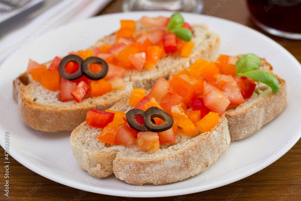 bread with tomato, pepper, olives and basil