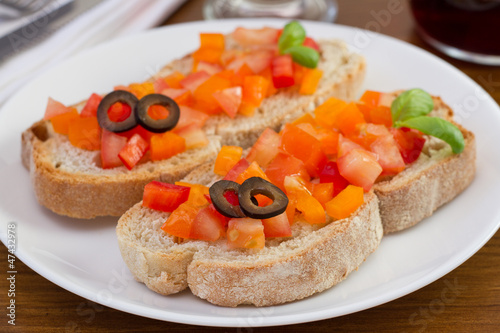 bread with tomato, pepper, olives and basil