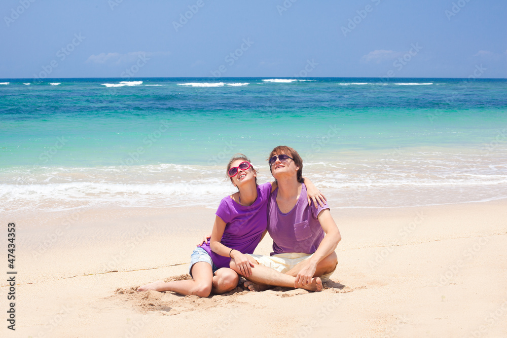young beautiful couple on tropical bali beach.honeymoon young beautiful couple on tropical bali beach.honeymoon