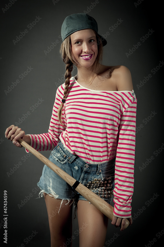 Smiling female with baselball bat Smiling female with baselball bat