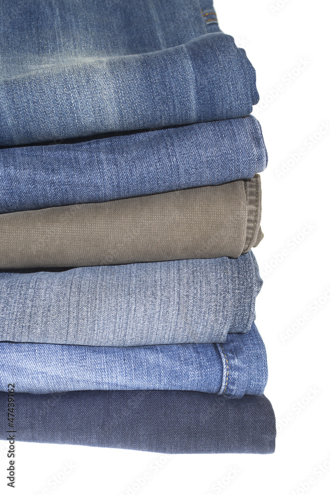 Stack of jeans isolated on the white Stack of jeans isolated on the white