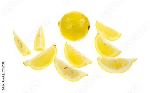 Lemon with lemon wedges photo