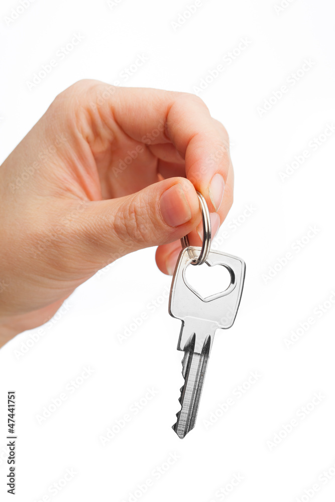 hand holding key isolated on white hand holding key isolated on white