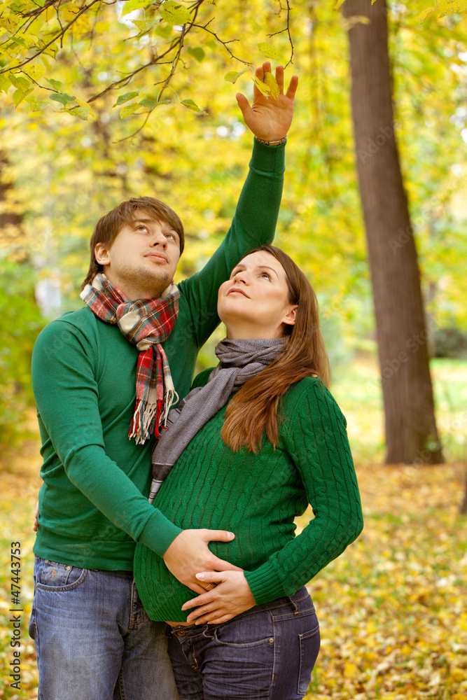 pregnant couple have fun in the park pregnant couple have fun in the park