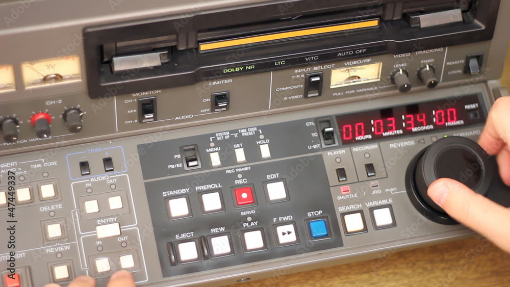 Editor working on Betacam Sp recorder Editor working on Betacam Sp recorder