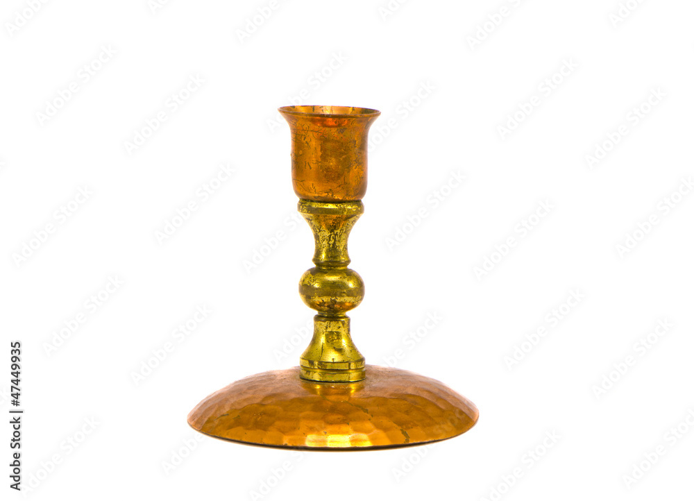 handmade brass candlestick isolated on white