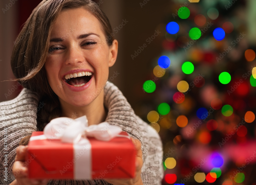 Portrait of happy woman with Christmas present box Portrait of happy woman with Christmas present box