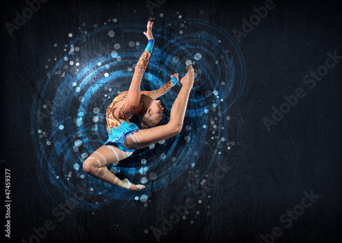 Young woman in gymnast suit posing photo