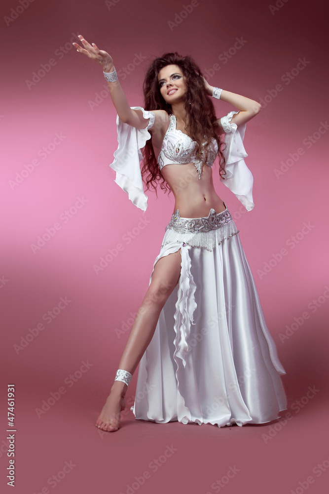 Beautiful slim woman belly dancer. Sexy Arabian oriental profess