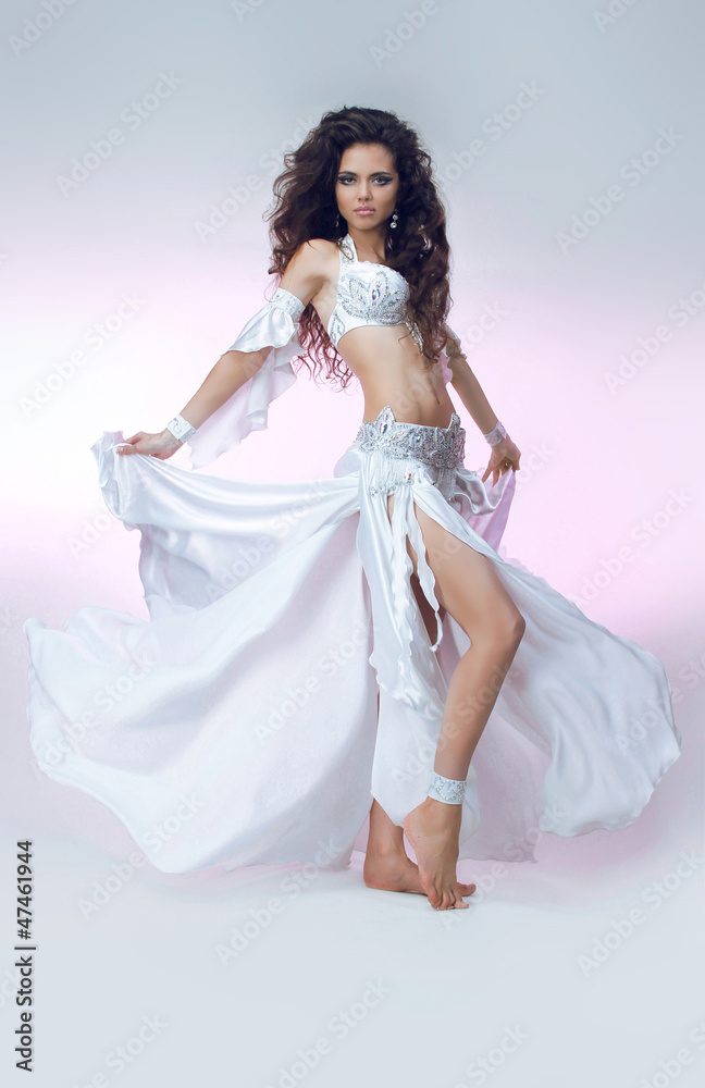 Young dancing girl with smart fair long hair in Oriental shining Young dancing girl with smart fair long hair in Oriental shining