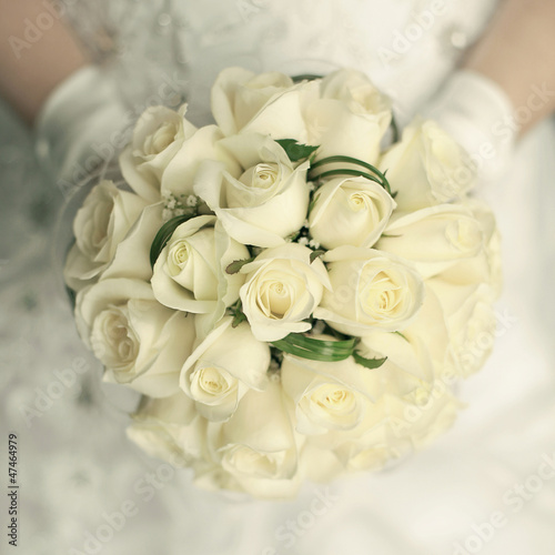 wedding bouquet at bride's hands. studio shot