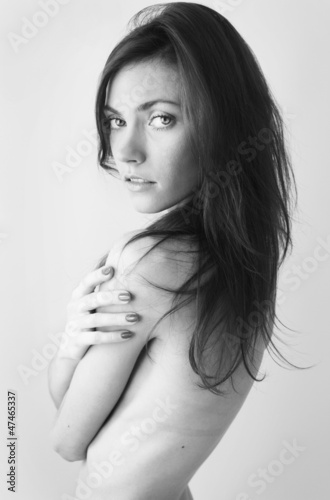 Photography Portrait of beautiful semi naked model looking sensitive