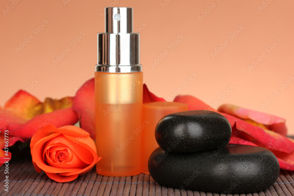 Women's perfume in beautiful bottle with rose Women's perfume in beautiful bottle with rose